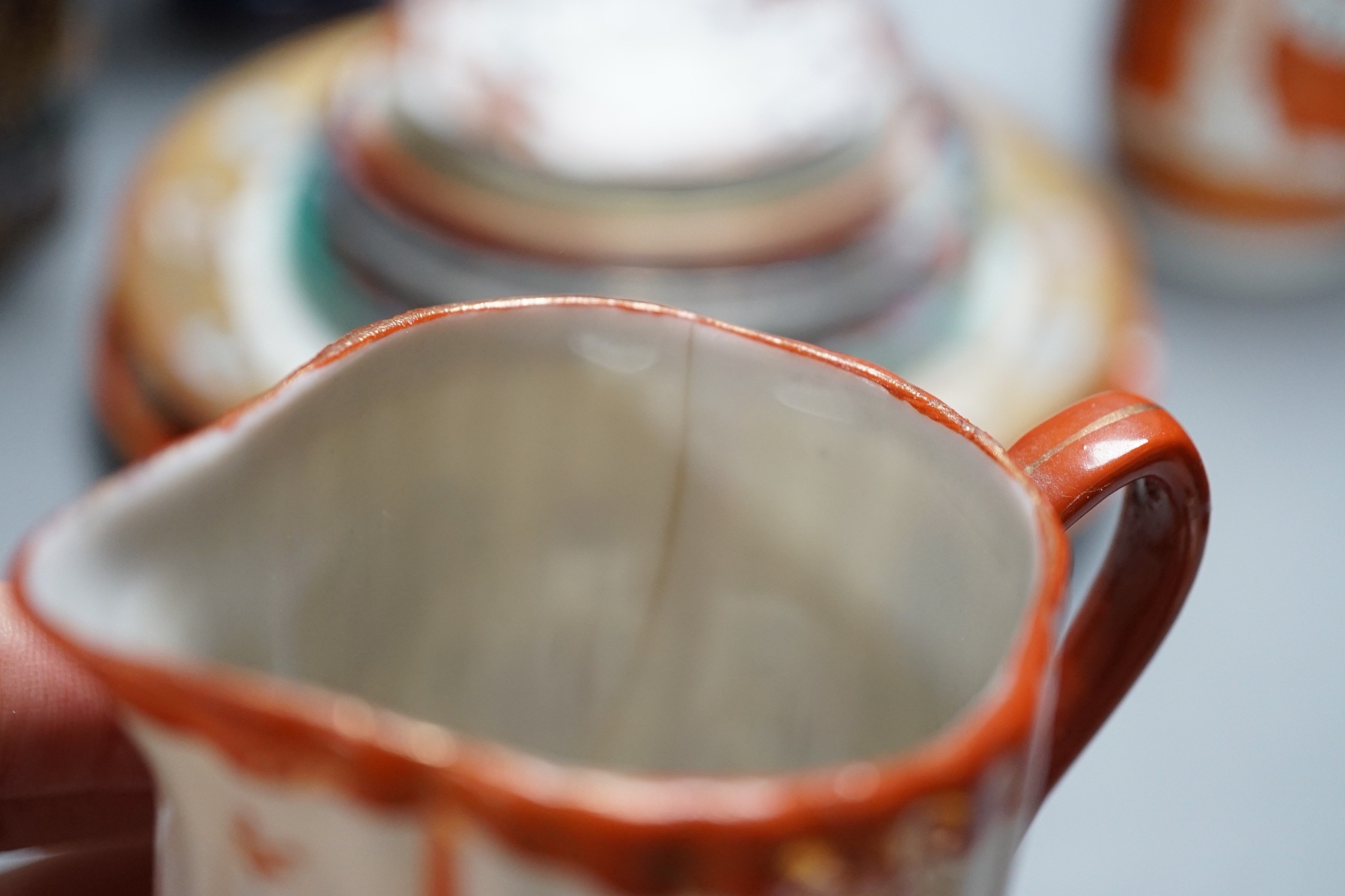 A mixed group of Japanese cloisonné enamel vases and porcelain vases and plates